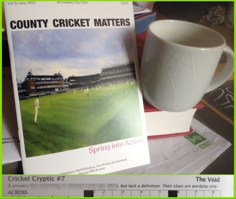 A copy of issue 15 of County Cricket Matters, next to a coffee cup. In a separate pane is a clip of the top of the cryptic crossword by The Void, revealing that 8 clues are wordplay only and [redacted].